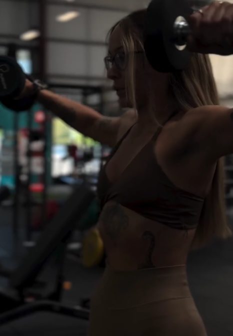 Personal trainer leading a gym workout captured for social media content in Moray.