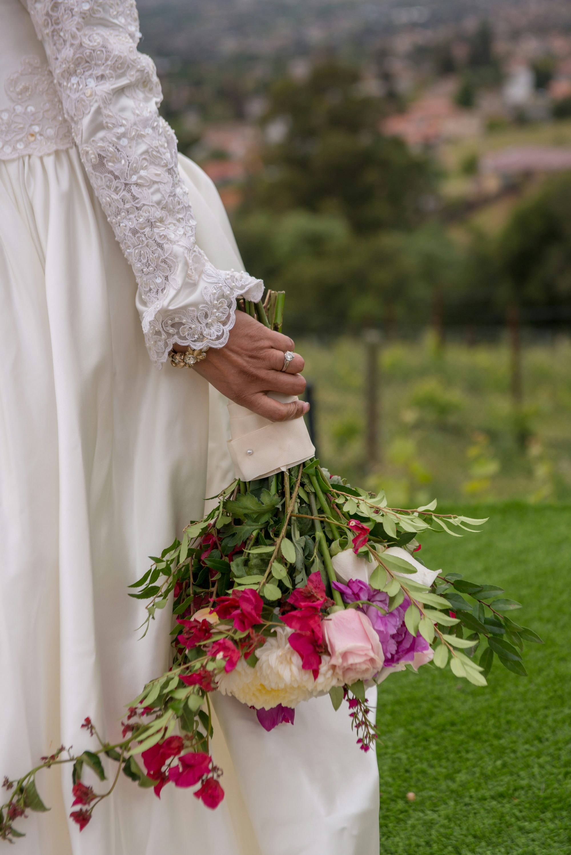 Close up personalised video shot of bride holding a colourful bouquet in Moray, Scotland