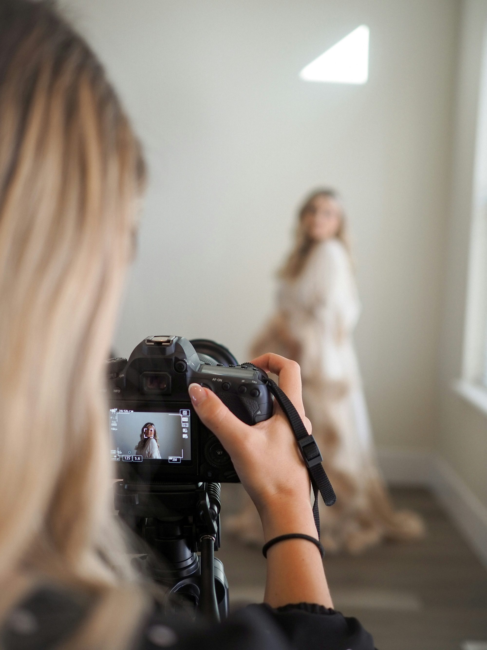 Business owner creating promotional content with a professional content creator.